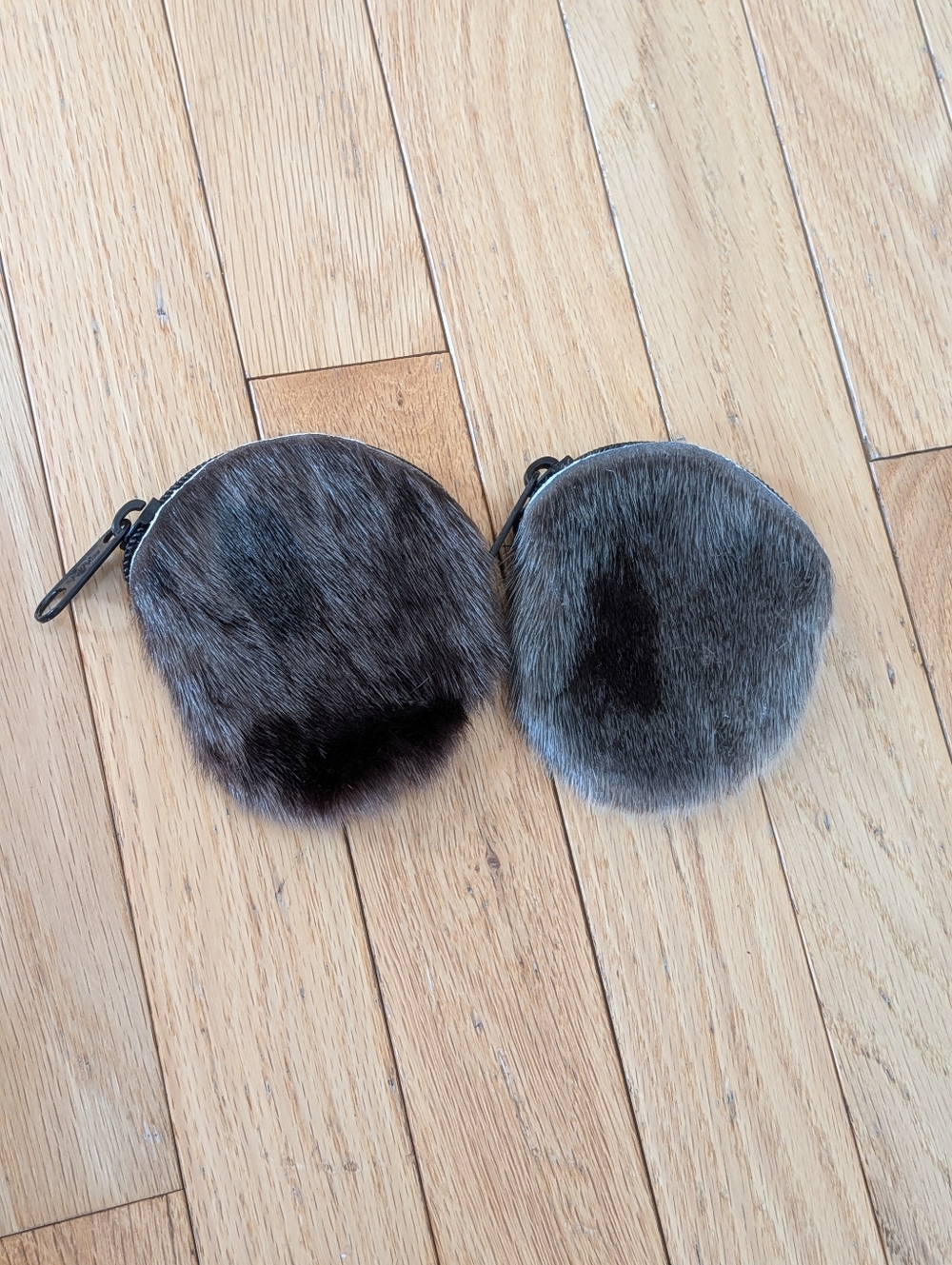 Two handcrafted seal skin and leather coin pouches